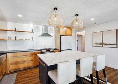 Fully stocked kitchen with modern appliances and dining table for six