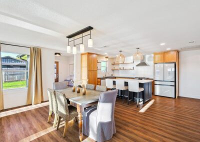 Fully stocked kitchen with modern appliances and dining table for six