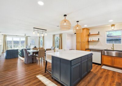 Cozy open-concept living room with plush sectional, smart TV, and natural light