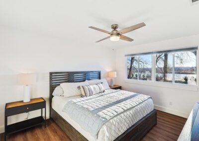 Primary bedroom with king bed, soft bedding, and clean-fresh decor