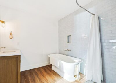 Bright and clean full bathroom with modern fixtures and soft towels