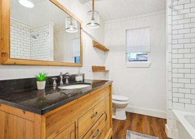 Bright and clean full bathroom with modern fixtures and soft towels